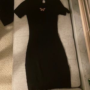 Black fitted knee length with butterfly on front